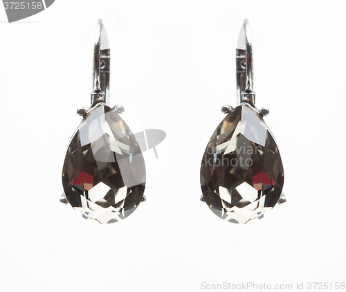 Image of earrings with black stones on the white