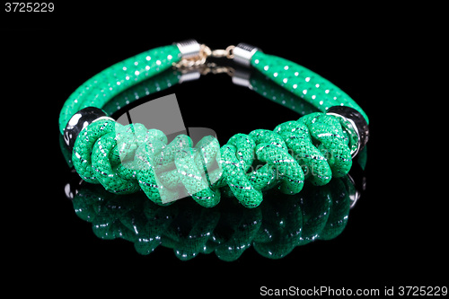 Image of green Rope Necklace. on black background