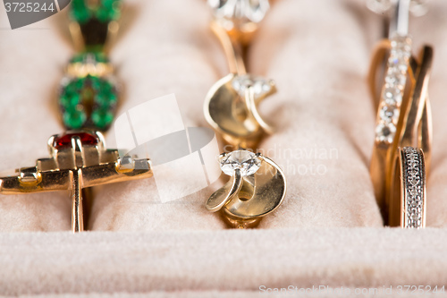 Image of box with jewelery. Rings and pendants. 