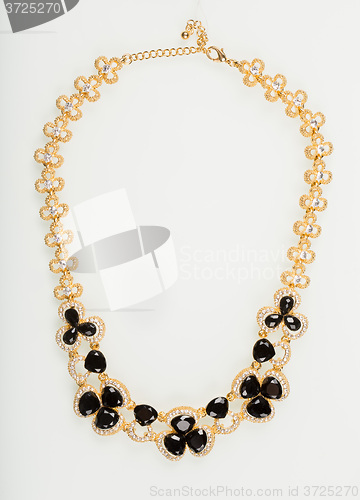 Image of Necklace with black pearls on a white 