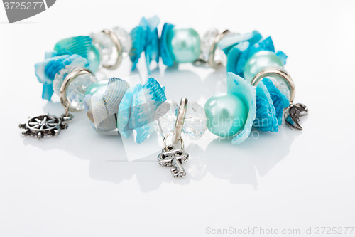 Image of blue bracelet with pendants 