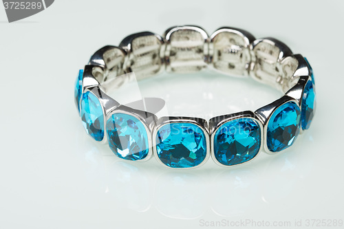 Image of Bracelet with blue stones over white