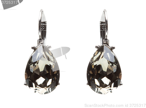 Image of earrings with black stones on the white