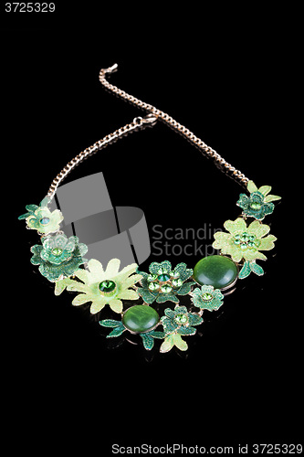 Image of metal feminine necklace. in the form of flowers