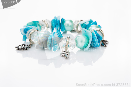 Image of blue bracelet with pendants 