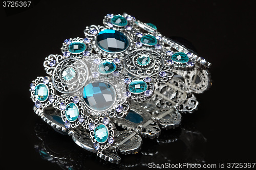 Image of Bracelet with blue stones over black 