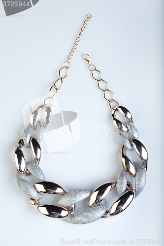 Image of plastic necklace. gold, Platinum