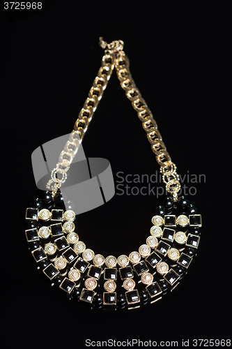 Image of metal feminine necklace. on white background. 