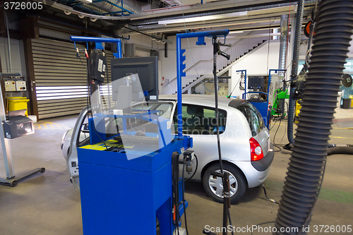 Image of Car waiting for technical review in garage.