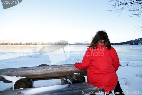 Image of Woman by a lake