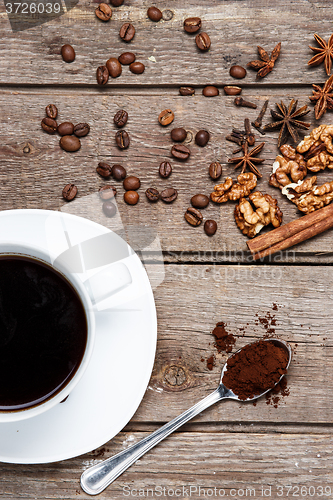 Image of The cup of coffee on wooden table