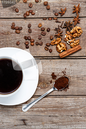 Image of The cup of coffee on wooden table