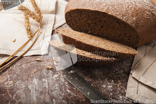 Image of Bread rye spikelets on an wooden background