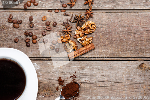 Image of The cup of coffee on wooden table