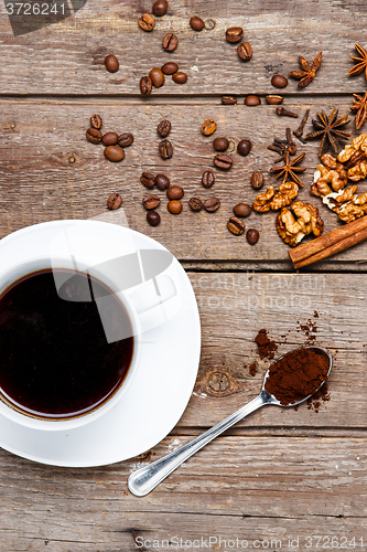 Image of The cup of coffee on wooden table