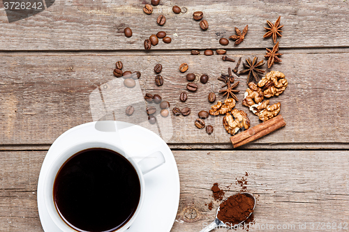 Image of The cup of coffee on wooden table