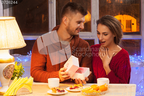 Image of Portrait of romantic couple at Valentine\'s Day dinner