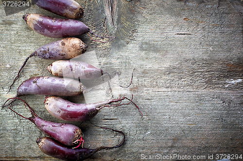 Image of Beet roots on wooden table