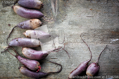 Image of Beet roots on wooden table