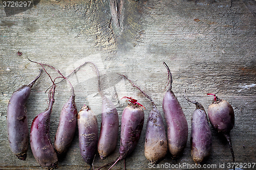 Image of Beet roots on wooden table