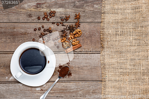 Image of The cup of coffee on wooden table