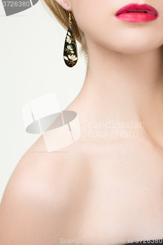 Image of close up of woman wearing shiny diamond earrings