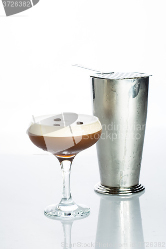 Image of Layered Chocolate Cocktail with Whipped Cream in Glass Isolated White Background