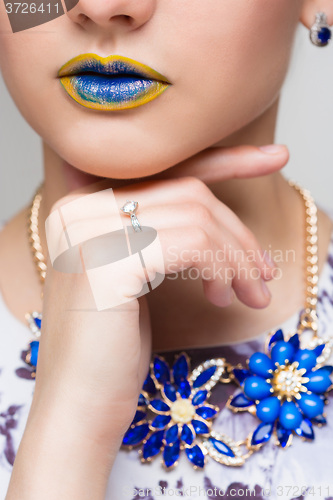 Image of Fashion Yellow, Blue Sexy Lips and Closeup. Make up concept. 