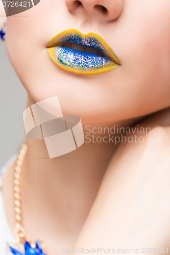 Image of Fashion Yellow, Blue Sexy Lips and Closeup. Make up concept. 