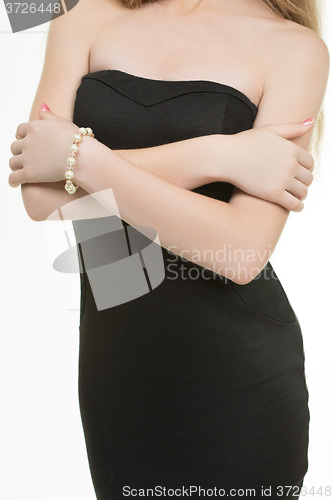 Image of hands close-up of a young girl with bracelet