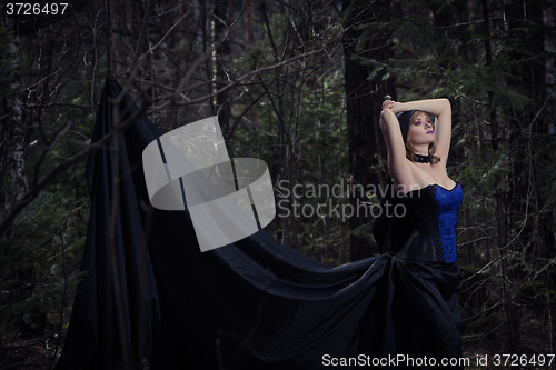 Image of witch girl in forest