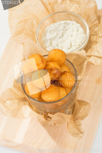 Image of Breaded potato balls with sauce