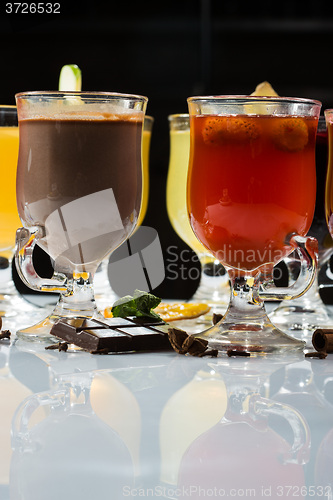 Image of mulled wine. fruit or berry drink. alcohol winter. against a dark background