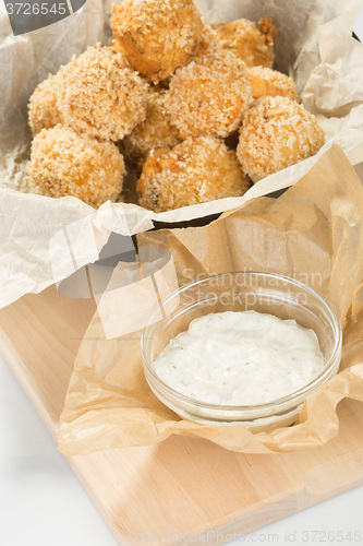 Image of Breaded potato balls with sauce