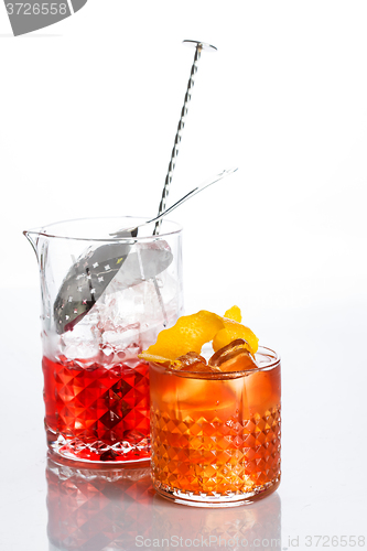 Image of Amber cocktail in a glass isolated on white background