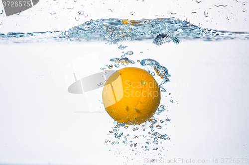 Image of orange splash in water 