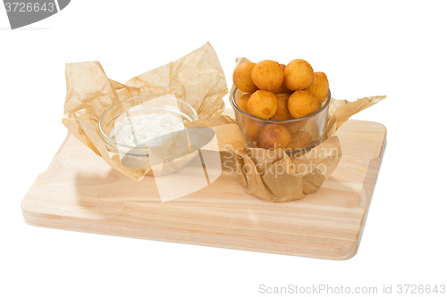 Image of Breaded potato balls with sauce