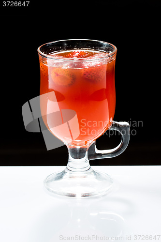 Image of mulled wine. fruit or berry drink. alcohol winter. against a dark background