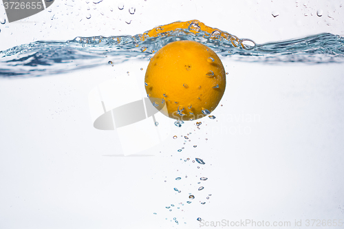 Image of orange splash in water 