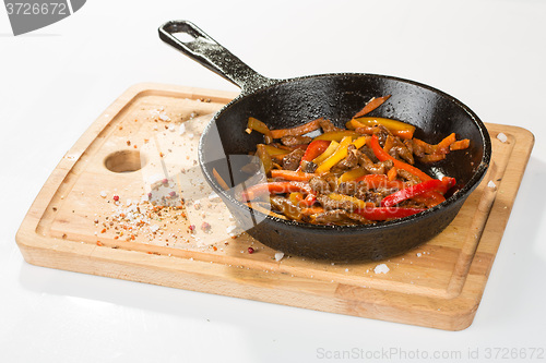 Image of Grilled pork. herbs in frying pan