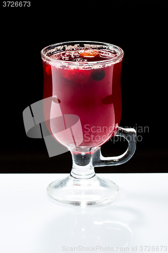 Image of mulled wine. fruit or berry drink. alcohol winter. against a dark background