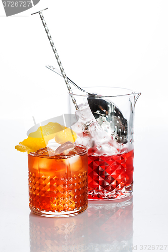 Image of Amber cocktail in a glass isolated on white background