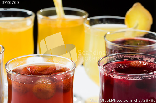 Image of mulled wine. fruit or berry drink. alcohol winter. against a dark background