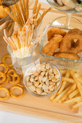 Image of set of different salty snacks. 