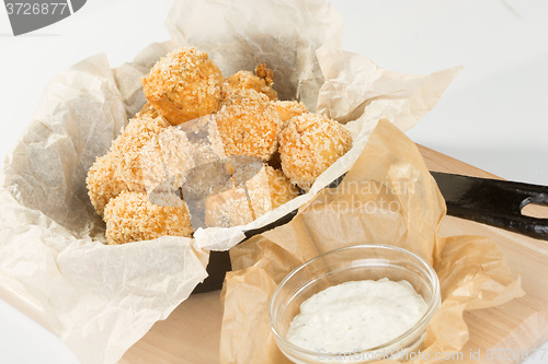 Image of Breaded potato balls with sauce