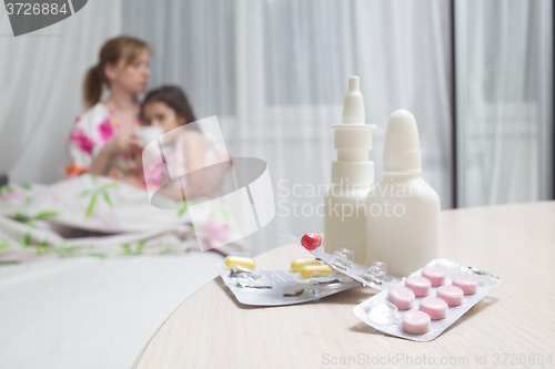 Image of mother embraces the sick child. sore throat, flu