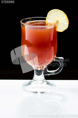 Image of mulled wine. fruit or berry drink. alcohol winter. against a dark background