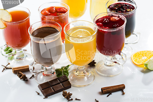 Image of mulled wine. fruit or berry drink. alcohol winter. against a bright background