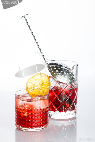 Image of Amber cocktail in a glass isolated on white background