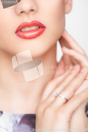 Image of Red Sexy Lips and Nails closeup. Open Mouth. Manicure and Makeup. Make up concept. 